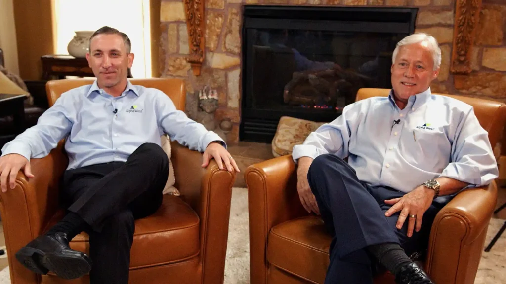 Paul Matthews and Jared Schwab sitting on chairs talking about Alpha West Marketing Group