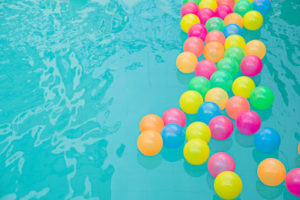 pool party with balloons in the water