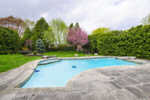swimming pool in the fall with additions that extend your pool season