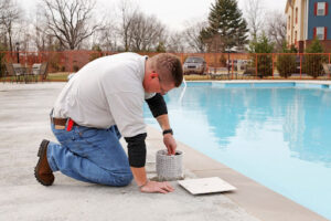 A pool service professional offering pool maintenance